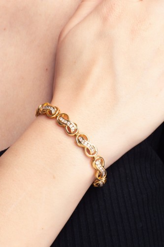 Złota bransoletka ze znakiem nieskończoności z diamentami