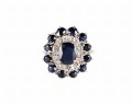Złoty pierścionek z centralnym szafirem 0,9 ct i diamentami szafirami wokoło
