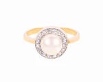 Złoty pierścionek z perłą słodkowodną i cyrkoniami