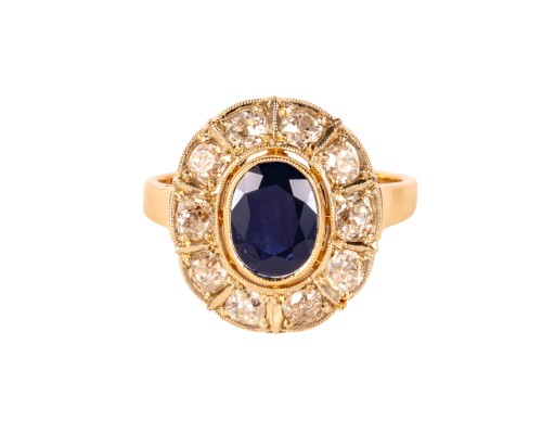 Złoty pierścionek z szafirem ok. 1,40 ct oraz diamentami dookoła